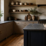 A kitchen with taupe cabinets and white countertops and accessories.